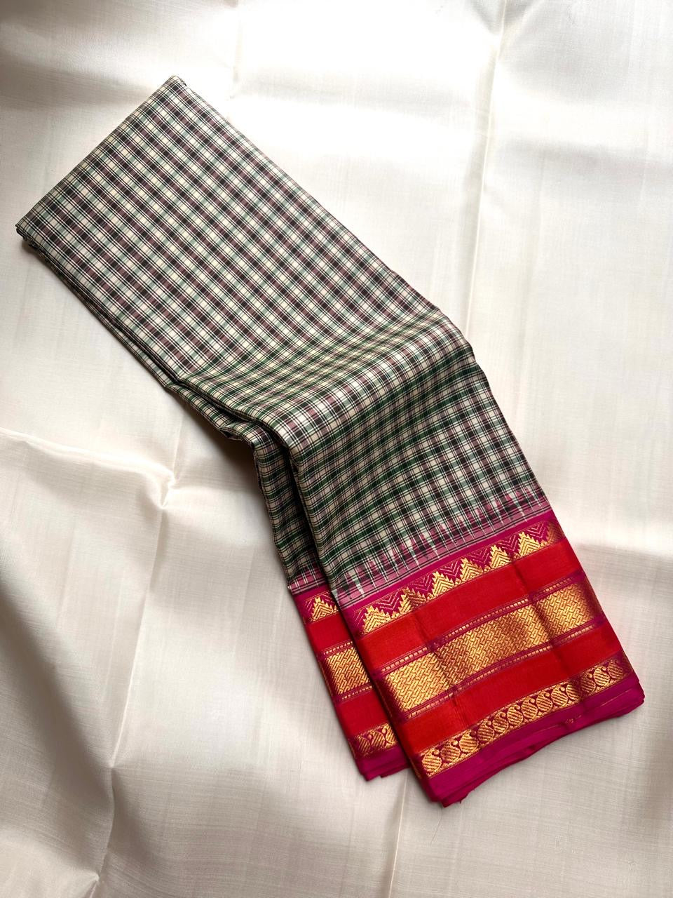 Full view of a Soft Ivory checked pure silk Kanjeevaram saree with raspberry-red border and gold zari.