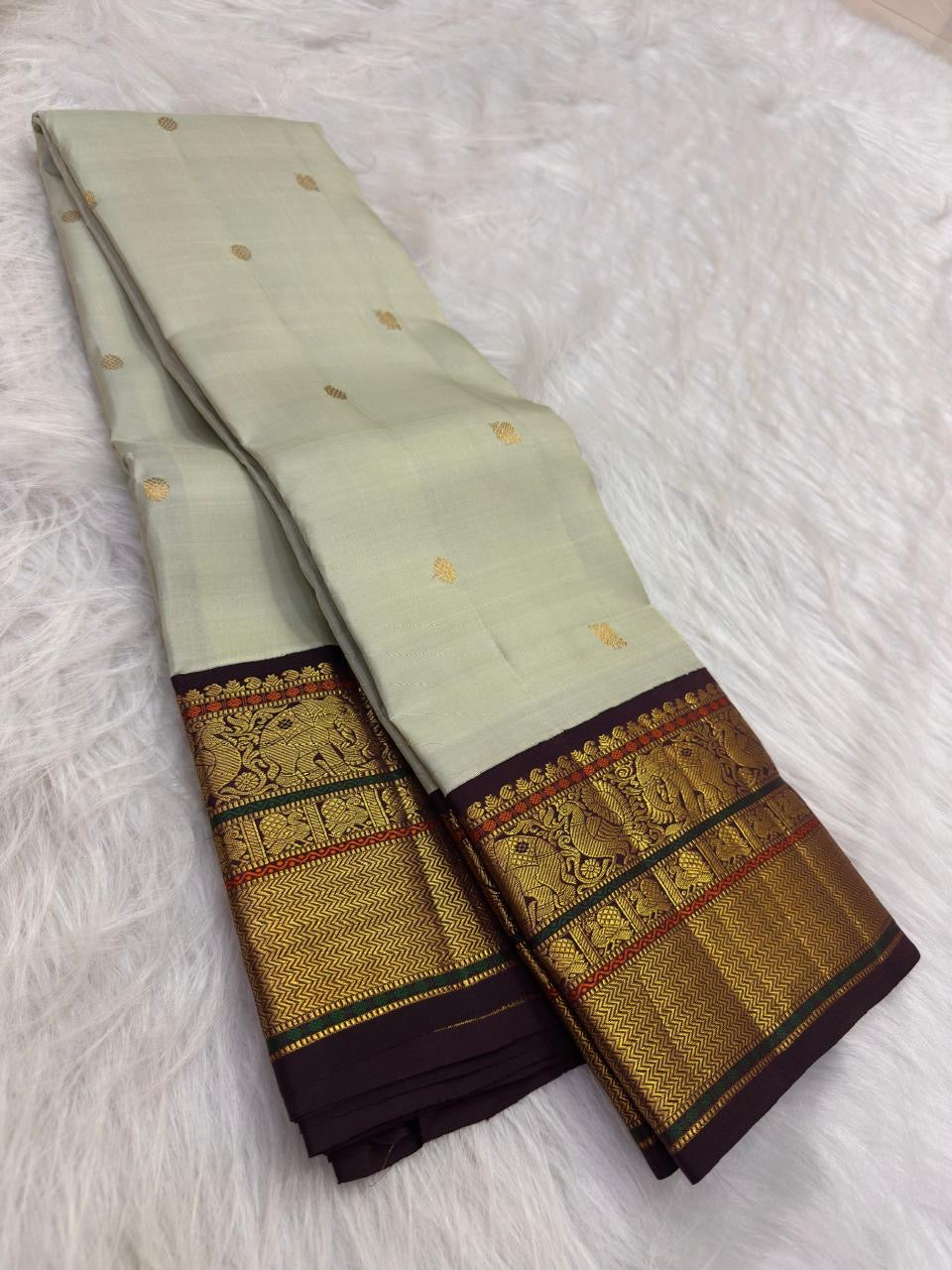Ivory Green Undertone Handwoven Pure Silk Kanjipuram Saree with Aubergine Korvai Mayil Zari Border