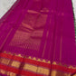 Close-up of the checked body with forest green, berry, black, and raspberry lines on ivory silk.