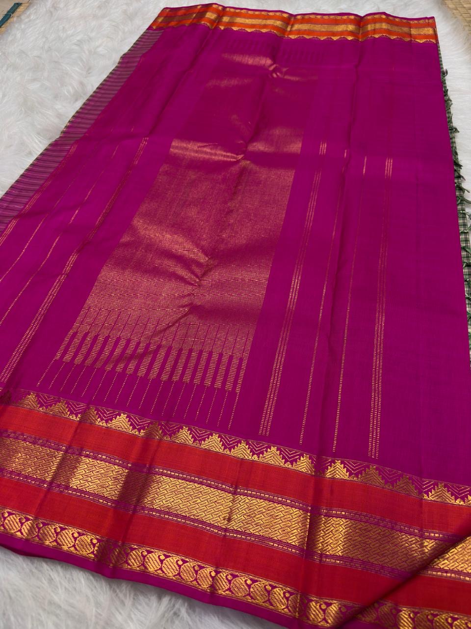 Close-up of the checked body with forest green, berry, black, and raspberry lines on ivory silk.