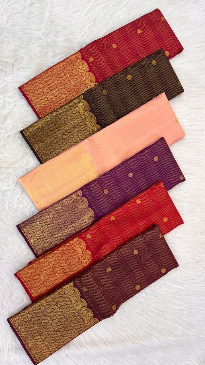 Open Soft Peach Blush Pure Silk Kanchipuram saree showing richly woven gold zari pallu and ornamental border.