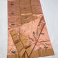 Handwoven blush peach Chanderi saree with delicate floral motifs