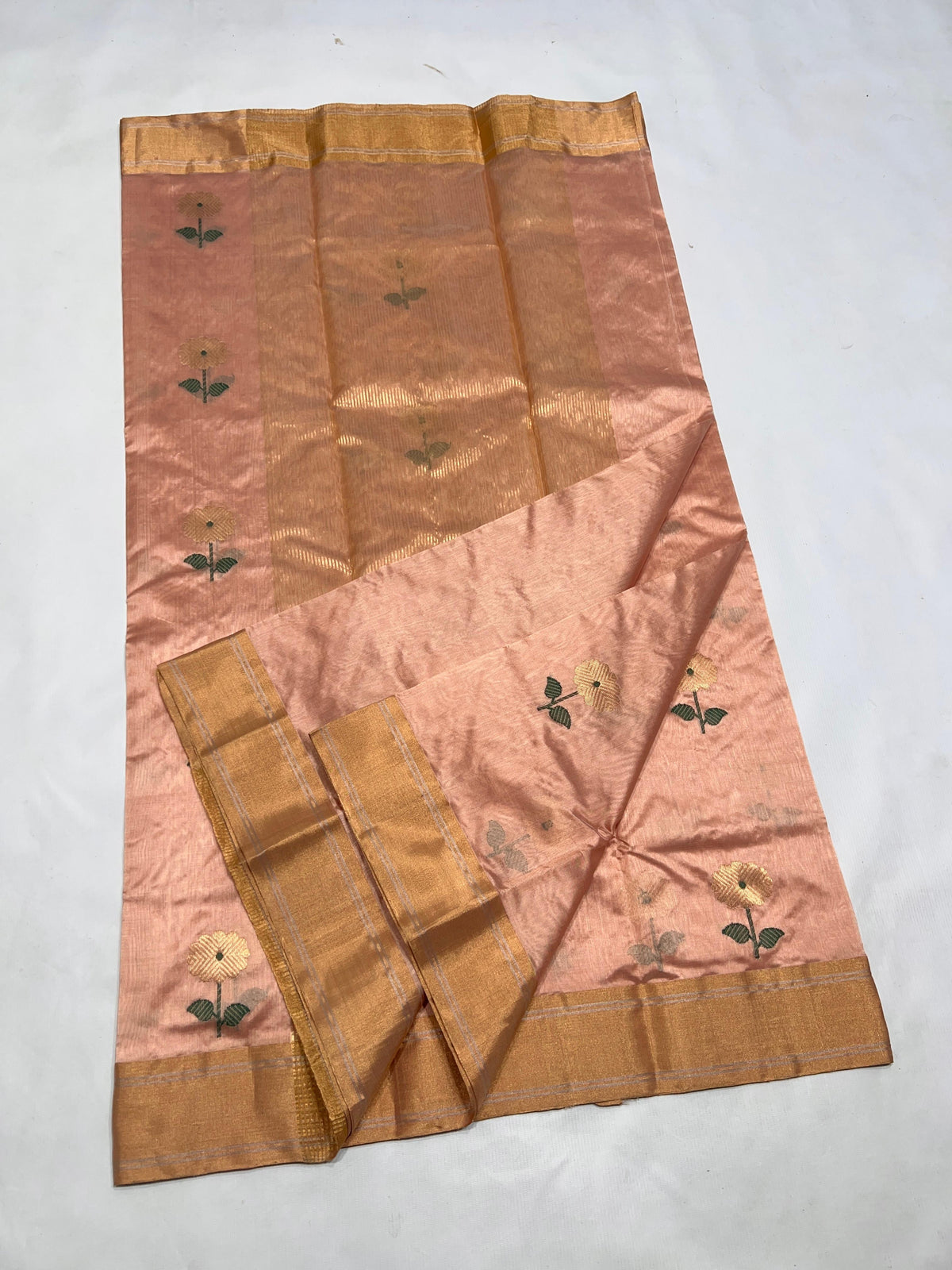 Handwoven blush peach Chanderi saree with delicate floral motifs