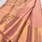 Close view of Soft Peach Blush Kanchipuram silk with fine gold Kattam structure and multi-register zari border.