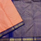 Soft peach ivory Kanchi Kattam saree with royal blue border, styled view