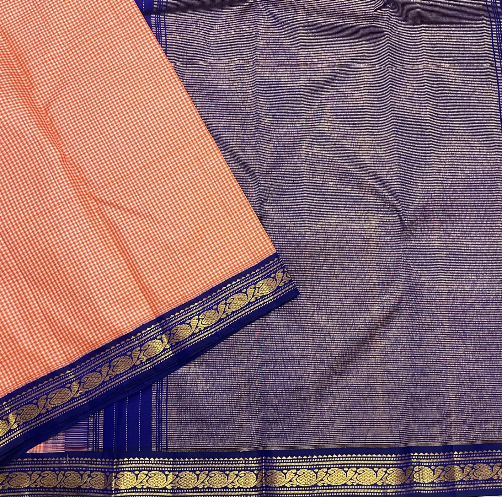 Soft peach ivory Kanchi Kattam saree with royal blue border, styled view