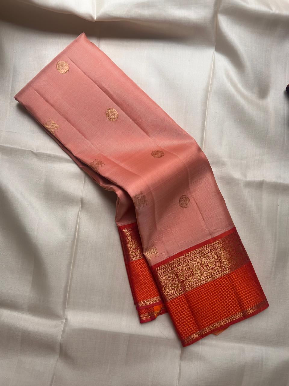 Soft peach pink Kanjipuram saree, gold zari butta detail