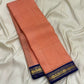 Soft peach ivory Kanjeevaram silk saree with royal blue zari border, full view