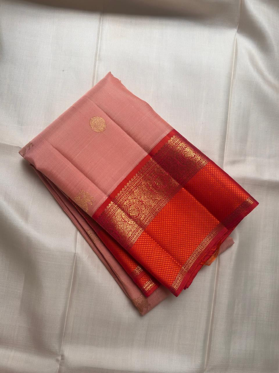 Soft peach pink Kanjipuram saree, Kaal Irangiya border detail