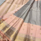 Soft Peach Pink and Silver Grey pure silk Kanjivaram Butta saree with antique-gold border.
