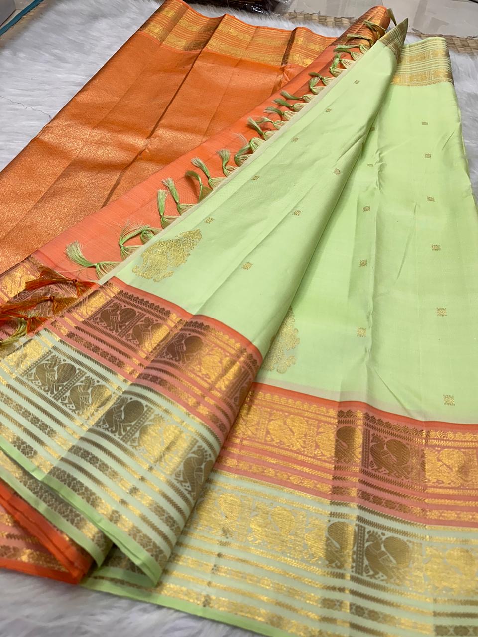 Soft Pistachio Green KanchiPattu silk saree, gold zari butta motif close-up — Idam Living
