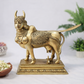 Front view of pure brass Kamadhenu Hindu traditional sculpture with intricate carvings and ornate pedestal base 8 inch