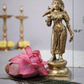 Side angle of solid brass Madurai Meenakshi idol showing intricate jewelry detailing and pedestal base