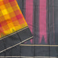 Turmeric yellow Kanchi Kattam Kanchipuram silk saree, close-up of yellow, orange and raspberry red checks with pinstripes