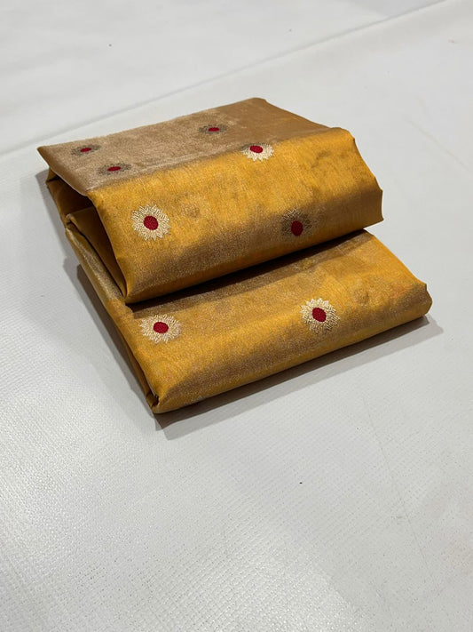 Yellow silk surface with small circular woven details and soft folds