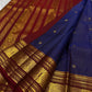 maroon zari woven border closeup with large circular elephant medallions on kanchipuram silk saree