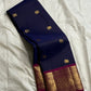 Stacked navy Pure Kanchipuram silk saree showing gold elephant buttas and an ornate zari woven border with a magenta edge.