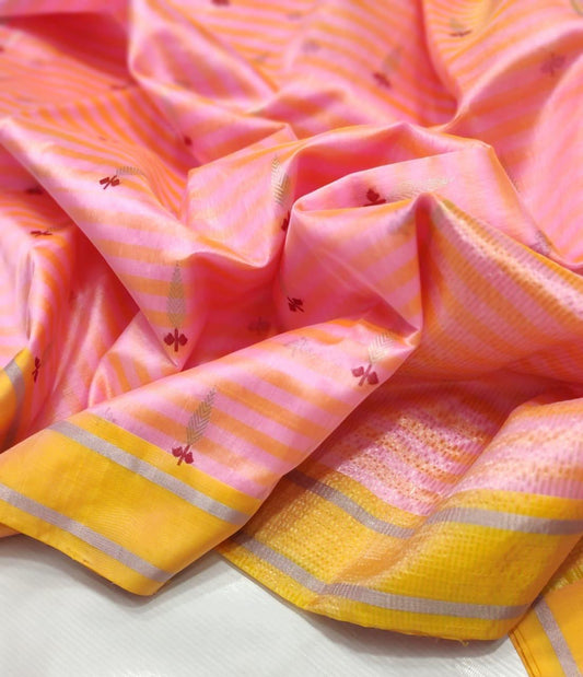Folded blush pink and mango striped silk saree with yellow border and fine silver zari lines.