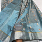 Steel blue handloom Chanderi saree showing spaced gold motifs with red centres and broad silver tissue border