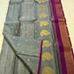 Close-up of ornate kamalam butta in gold zari on steel grey Kanjipuram silk saree — Idam Living