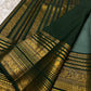 Deep forest green border with Vanasringaram Yaanai motifs in gold zari on sage green KanchiPattu