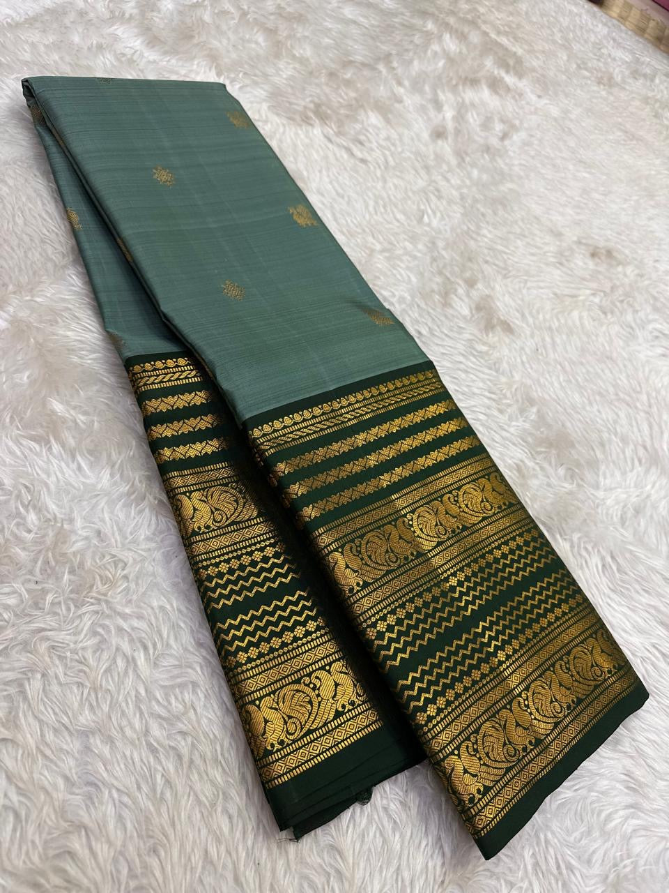 Sage green handwoven pure silk KanchiPattu saree with Varisaipet Floral Butta and Vanasringaram Yaanai border — Idam Living