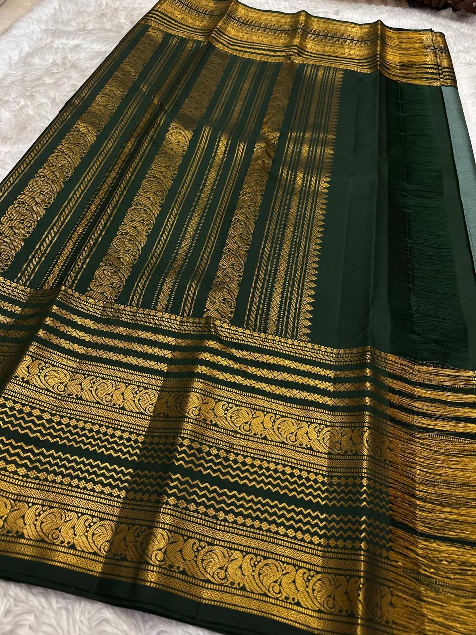 Deep forest green Vanasringaram Yaanai pallu in gold zari on sage green KanchiPattu saree