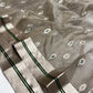 Stone Grey Katan Silk Chanderi saree showing the broad silver-tone border with twin Emerald Green lines.