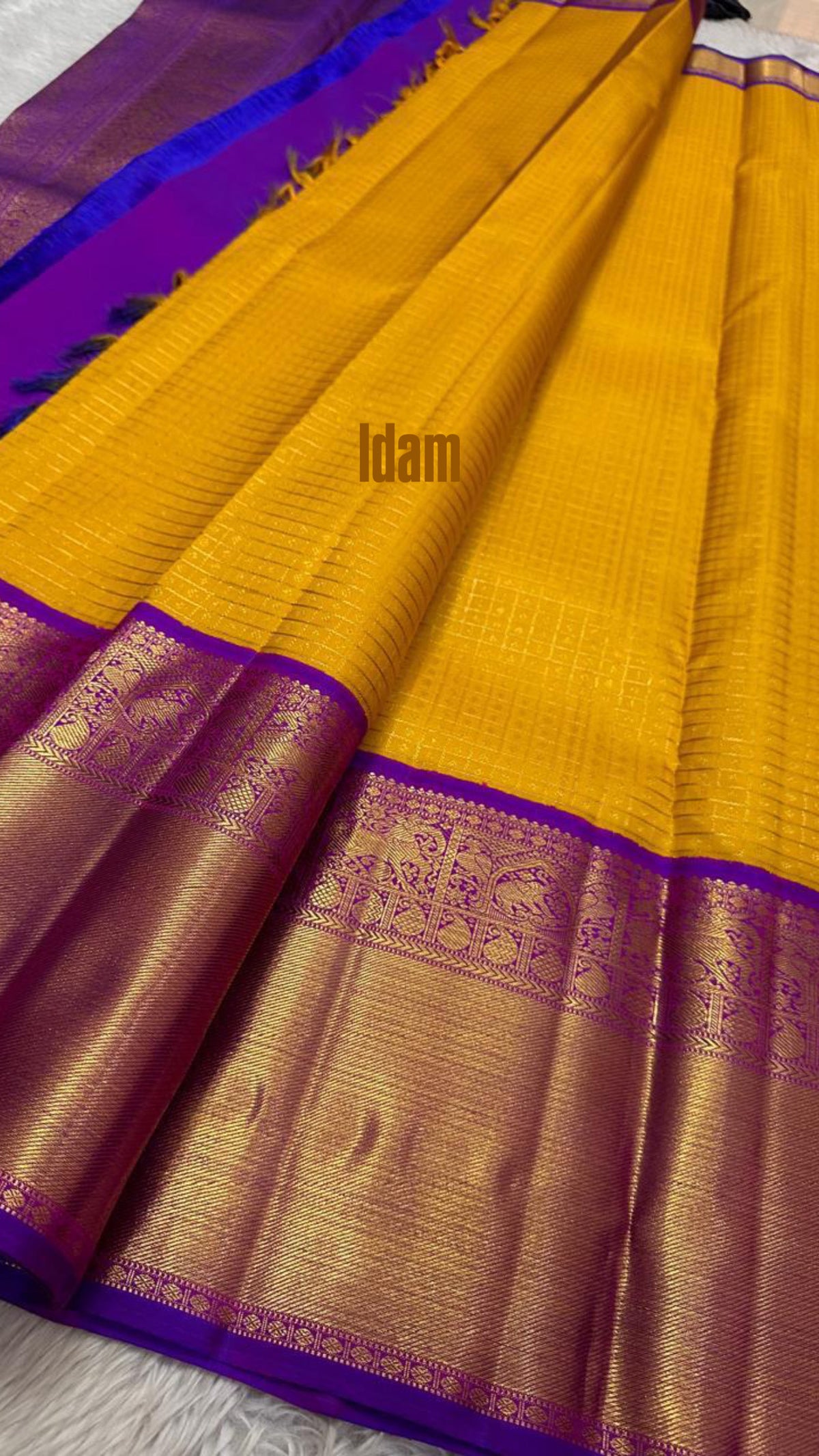 Broad purple Korvai border on sunflower yellow Pure Silk Kanjivaram saree