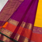 Close view of spaced Mayil gold-zari buttas across the sunflower-yellow pure silk body.