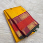 Sunflower-Manjal yellow pure silk body with evenly spaced traditional Mayil zari buttas.