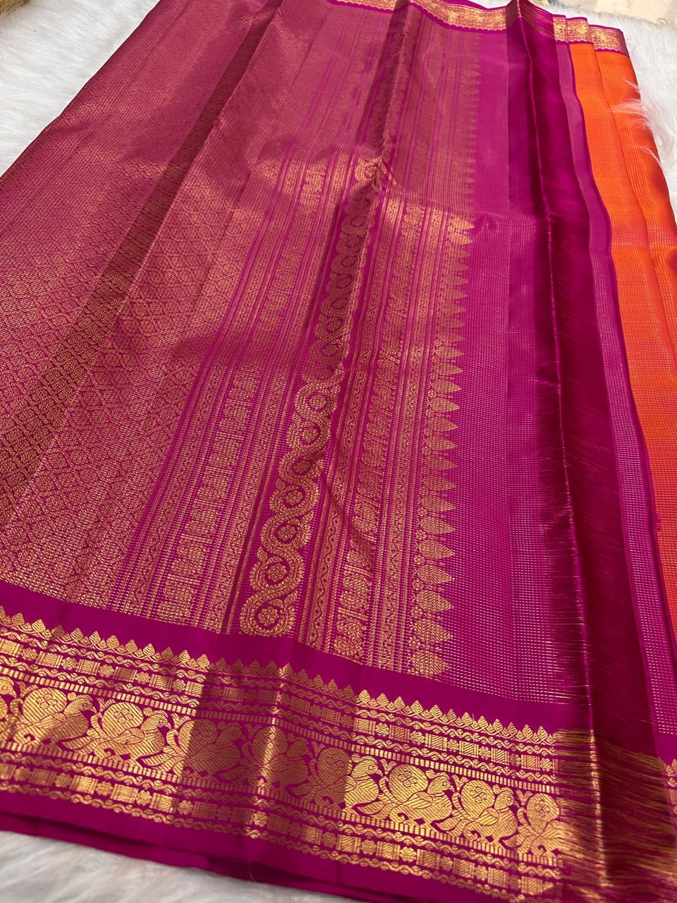Handwoven orange Kanjivaram Vairaoosi saree with beautiful gold zari buttas