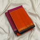 Sunset orange and pink Kancheepuram silk saree with forest green pallu