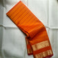 Kanchipattu silk saree in sunset orange with reddish pink border Veldhari Rettapet weave traditional zari detail