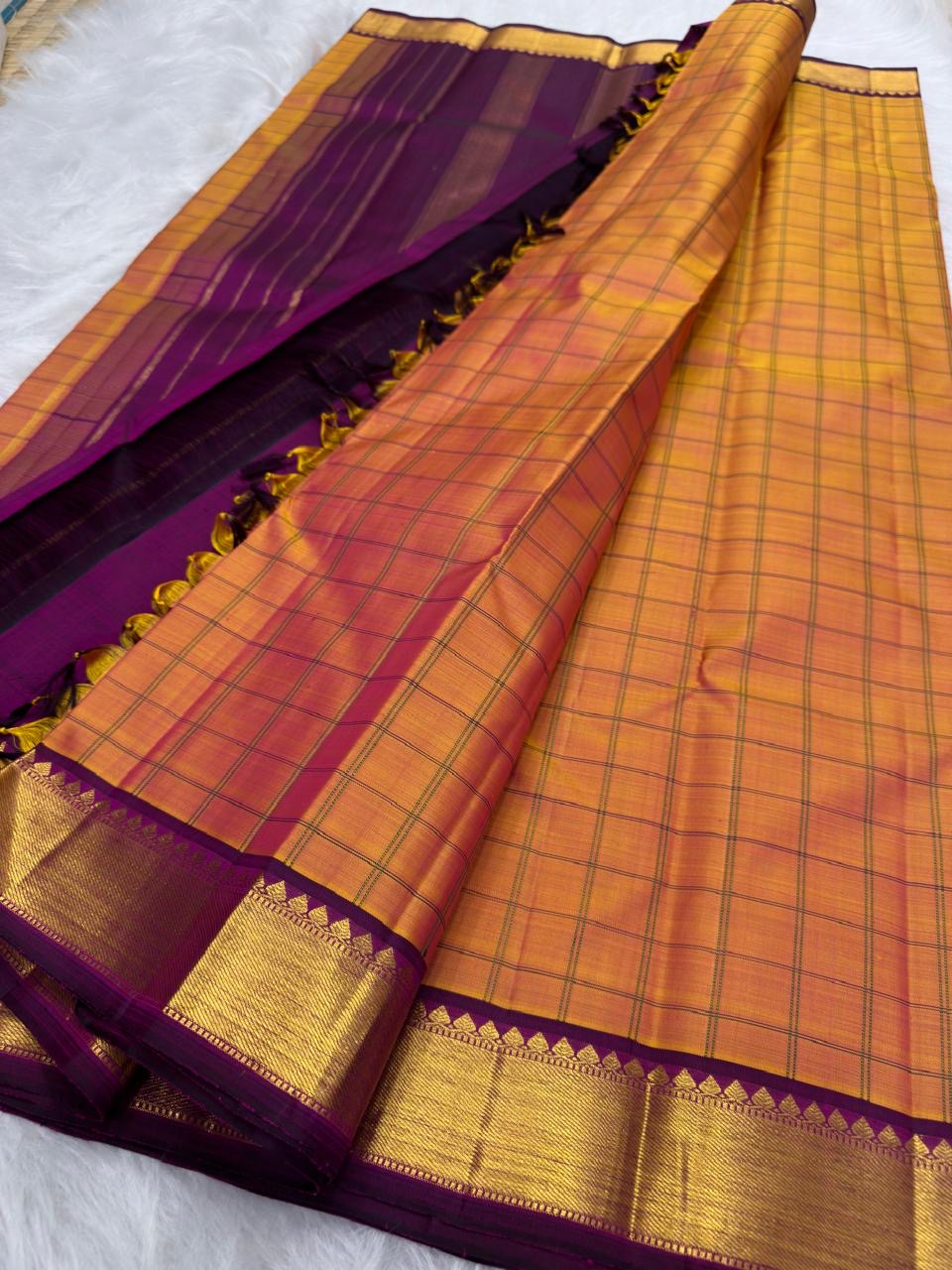 Handwoven Kanjivaram korvai saree in sunset orange shot colour with fine kattam checks