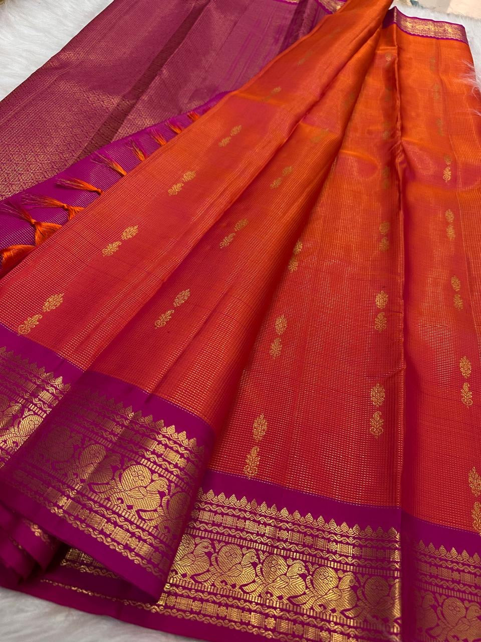 Intricate Raspberry Pink and antique gold zari Kanchipuram border
