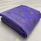 Folded amethyst lavender Pattu silk Chanderi saree showing silver-toned paisley buttas and silver-grey border