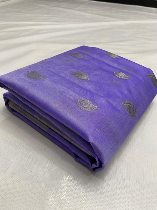 Folded amethyst lavender Pattu silk Chanderi saree showing silver-toned paisley buttas and silver-grey border
