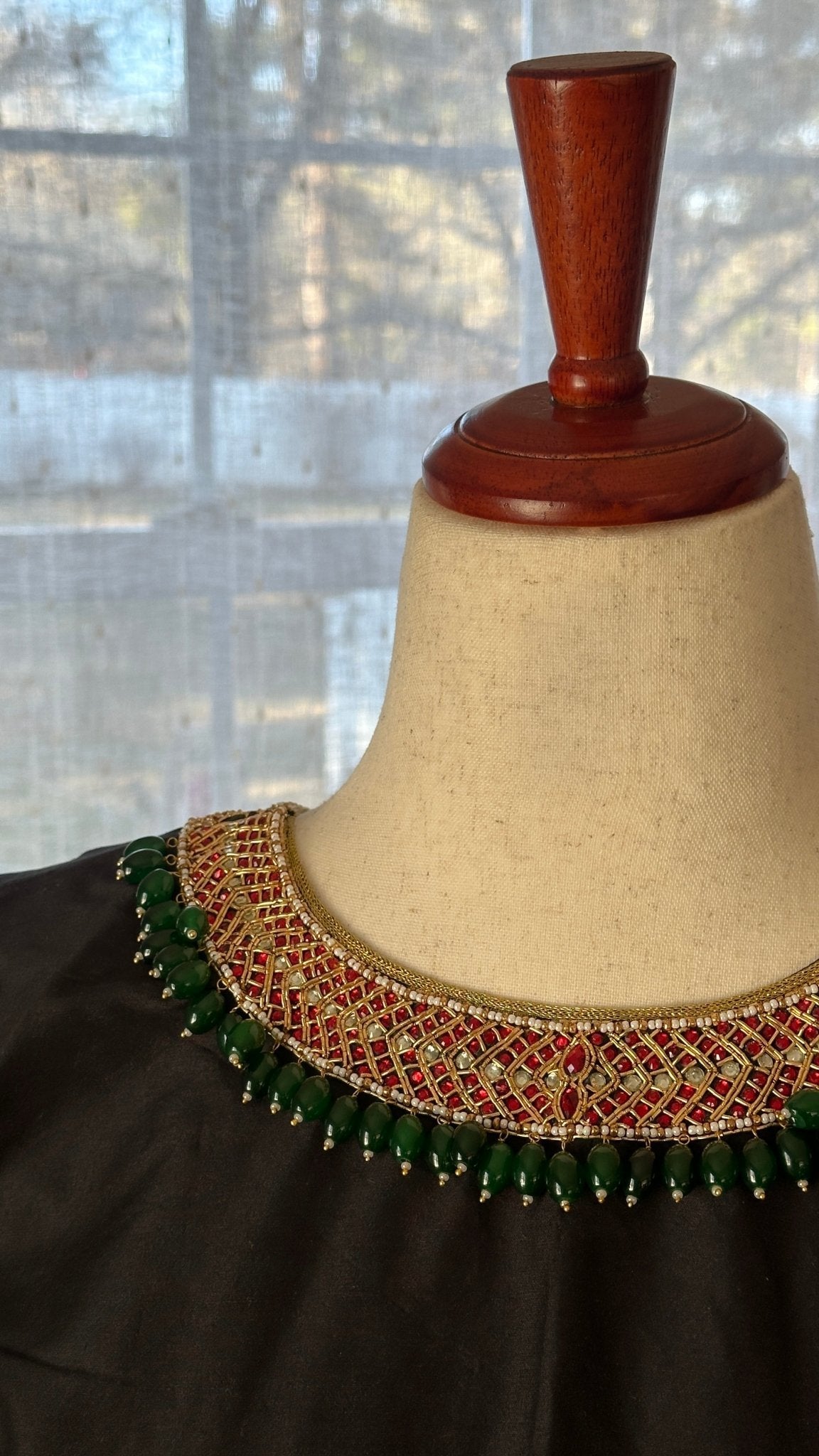 Front view of Tanjore black kemp embroidered silk cotton blouse with jewelry-style detailing