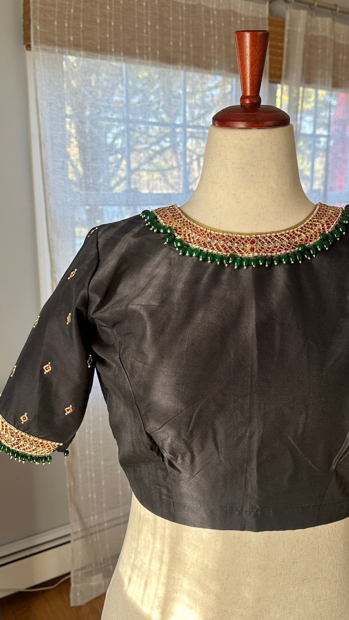 Made-to-measure black silk cotton Tanjore blouse designed as a statement jewelry piece