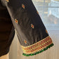 Detail view showing premium silk cotton fabric and temple jewelry-inspired embroidery on black blouse