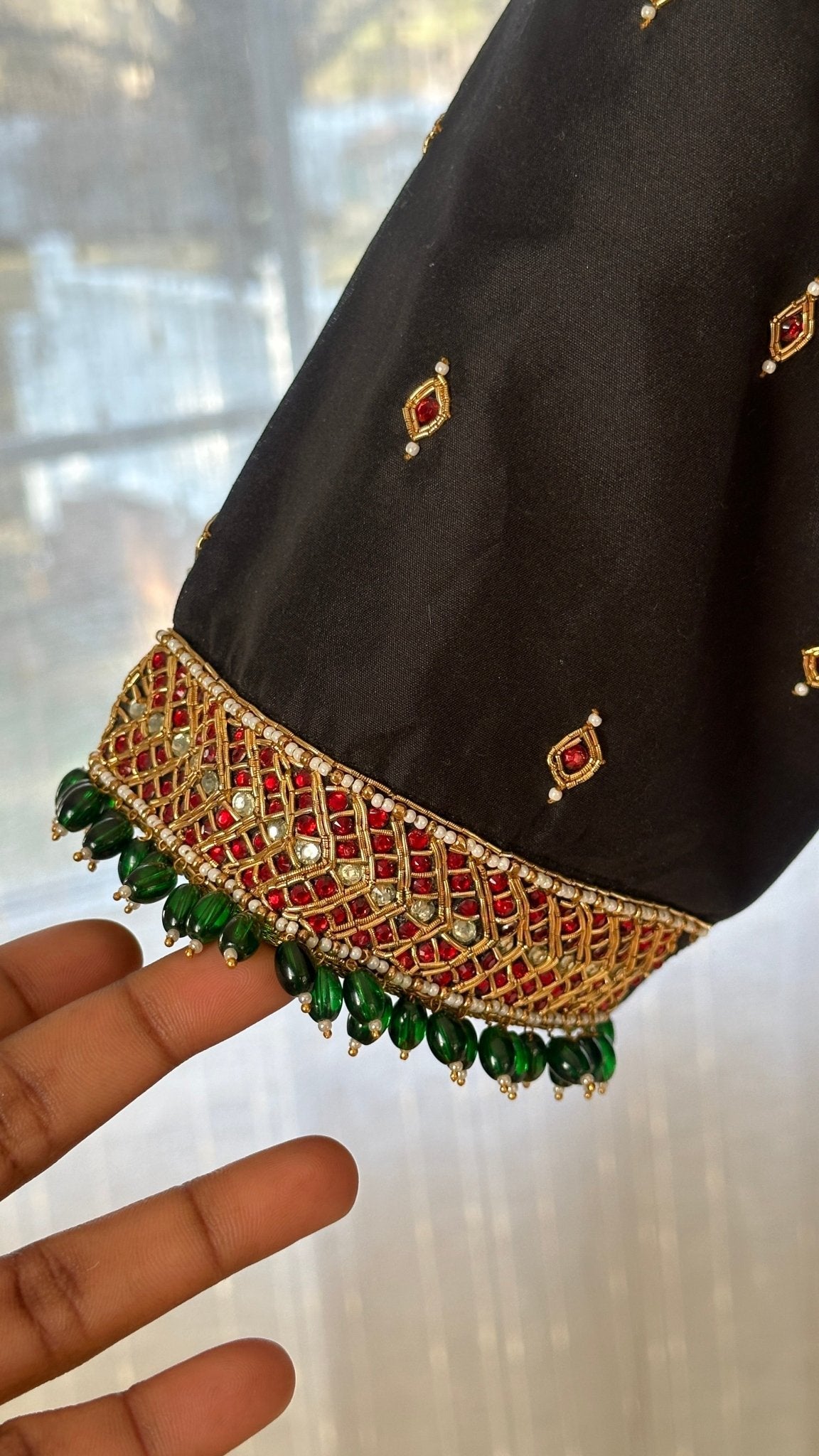 Made-to-measure black silk cotton Tanjore blouse designed as a statement jewelry piece