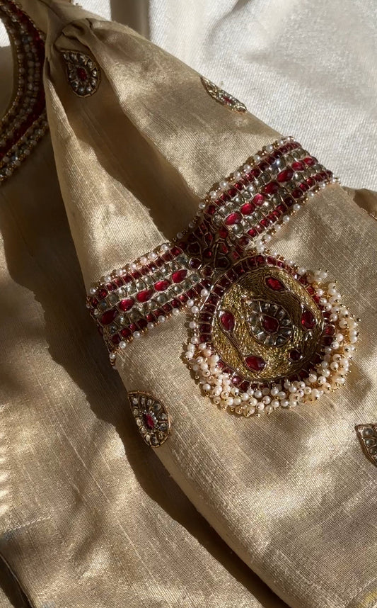 Front view of gold silk Tanjore Treasure blouse featuring jewelry-inspired embroidery