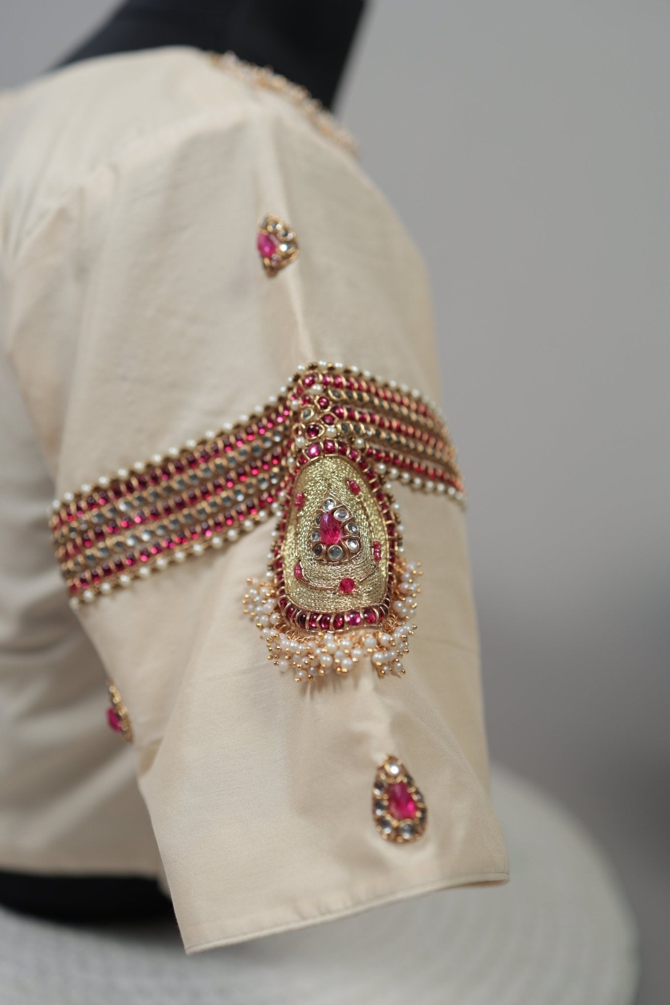 Handcrafted cream silk Tanjore Treasure blouse designed to pair with traditional silk sarees
