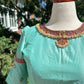 Pastel green silk Tanjore Treasure designer blouse with hand-set kemp stone embroidery