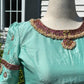 Back view of pastel green silk Tanjore Treasure blouse with premium kemp stone detailing