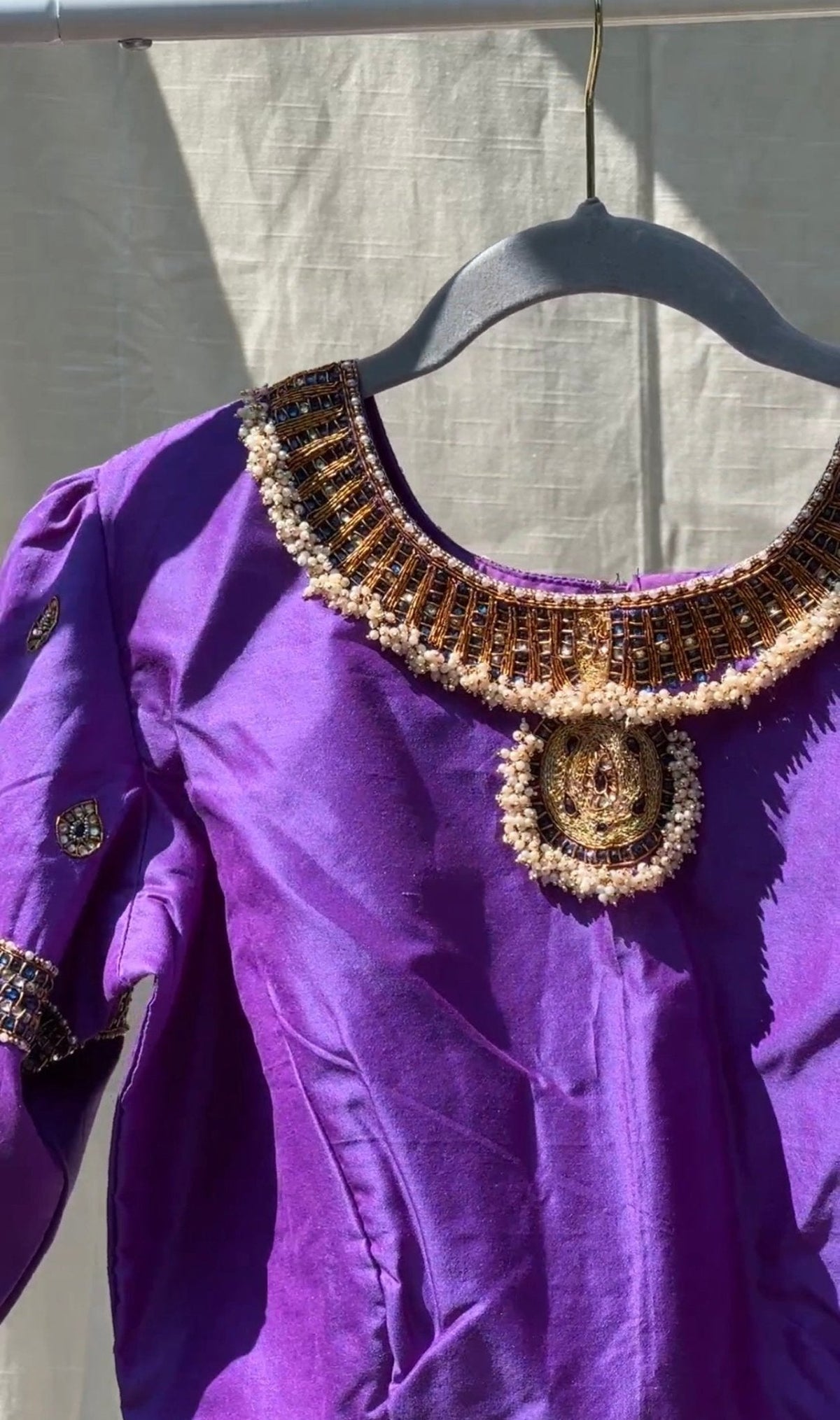 Detail of purple silk Tanjore Treasure blouse showing hand embroidery and long-lasting kemp stones