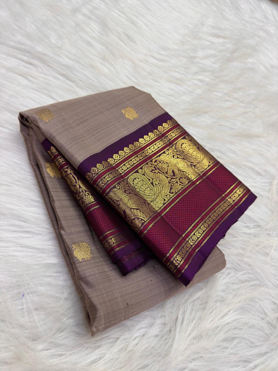 Taupe Brown Kanchipuram silk body with spaced gold zari buttas and richly woven purple Varisaipet border.