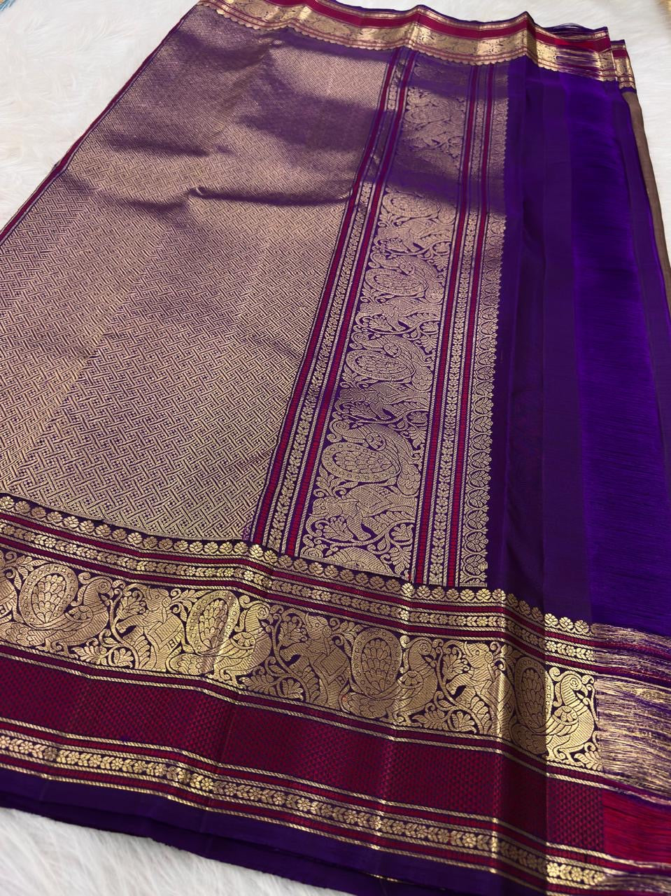 Deep Violet and Raspberry Varisaipet border with repeating gold Mayil motifs on pure Kanchipuram silk.