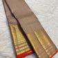 Close view of antique-gold geometric zari weaving on Smoky Taupe Kanchipuram silk.